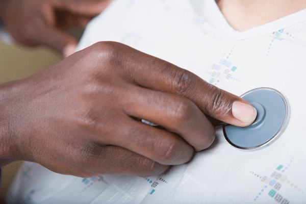 Hands on Stethescope Monitoring Heart